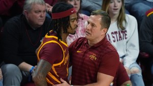 Iowa State basketball coach TJ Otzelberger talks to Keshon Gilbert.