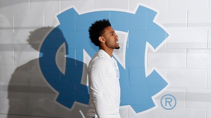 Joel Berry in front of UNC logo