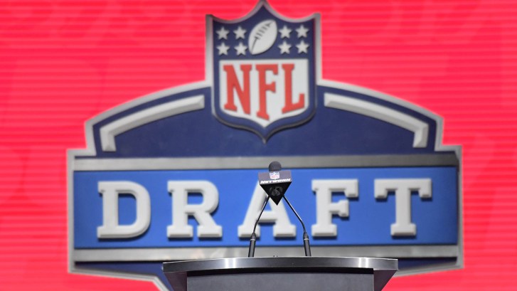 NFL Draft logo behind podium