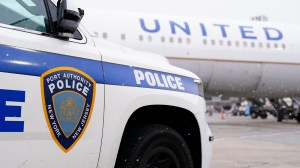 Police car next to United Airlines plane