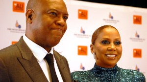 Rodney Peete and wife, Holly Robinson Peete, pose for a photo.