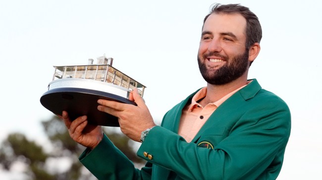 Scottie Scheffler holds trophy after winning The Masters