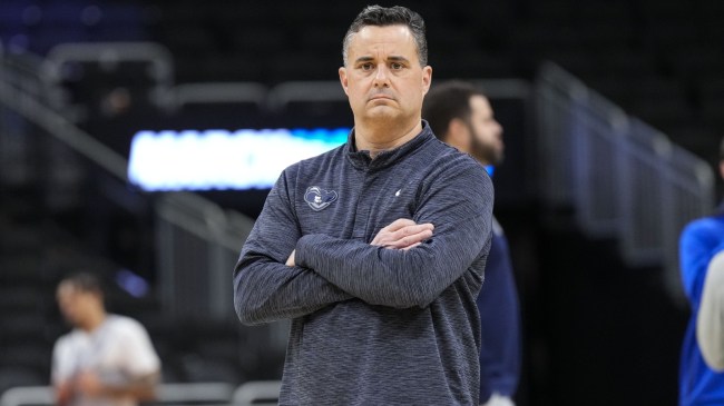 Xavier basketball coach Sean Miller on the floor.