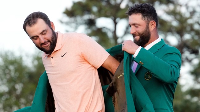 Jon Rahm present Scottie Scheffler with green jacket at The Masters