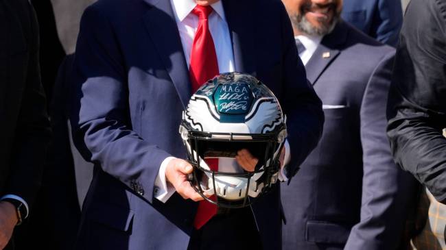 Apr 28, 2025; Washington, DC, USA; Detail of helmet held by President Donald Trump as he honors the Super Bowl LIX champion Philadelphia Eagles at The White House in Washington D.C., on April 28, 2025.