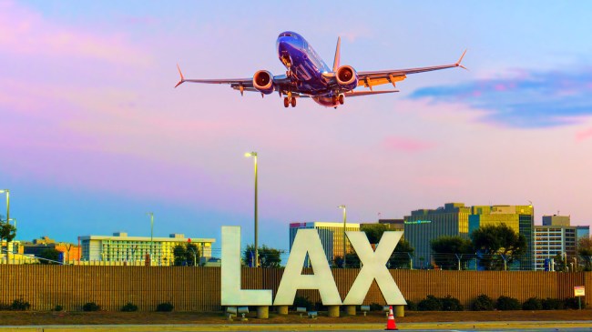 Airplane-Landing-Near-LAX-Sign-at-Los-Angeles-Airport
