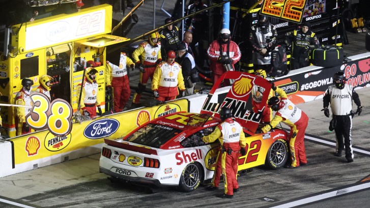 NASCAR driver Joey Logano of Team Penske has team look at engine