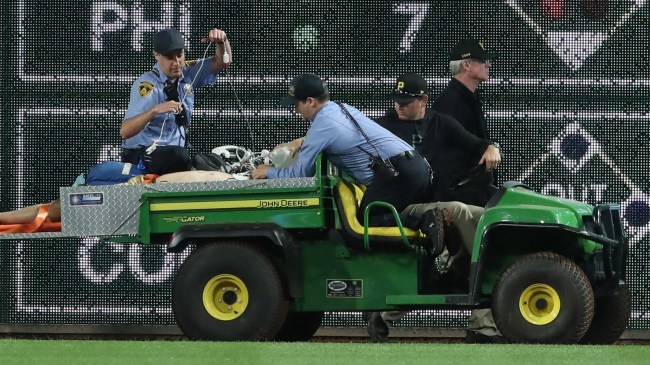 Stadium-security-and-Pirates-medical-personnel-cart-fan-who-fell-from-stands