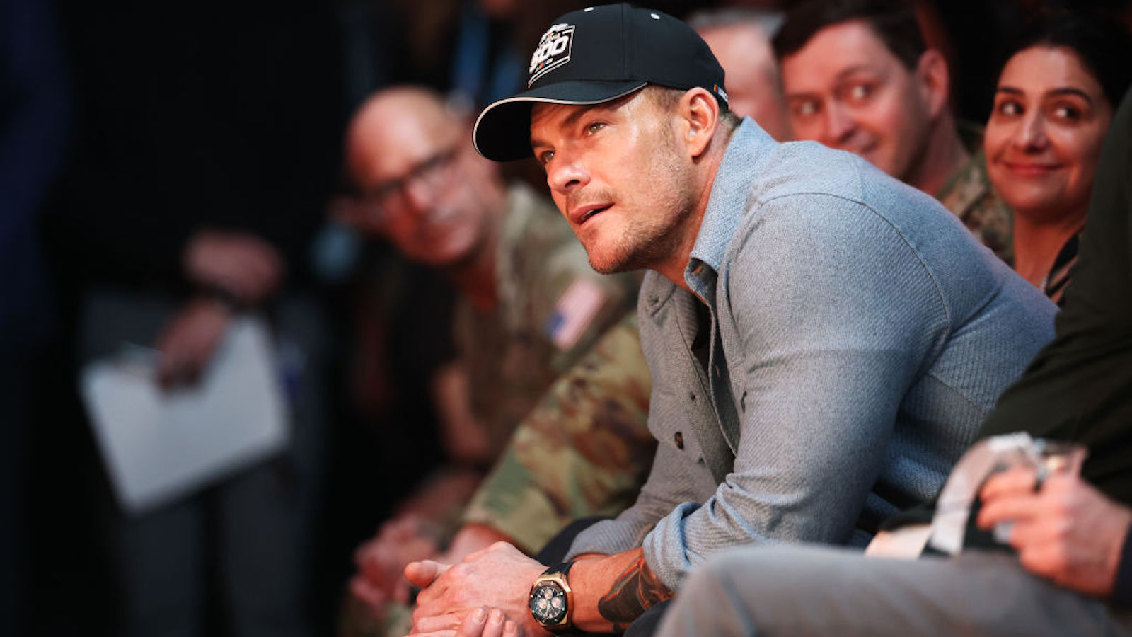 alan ritchson wearing a hat