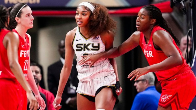 Angel Reese reacts to being fouled by Caitlin Clark.