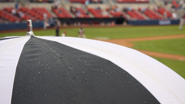 A stock image of a rainy baseball game.