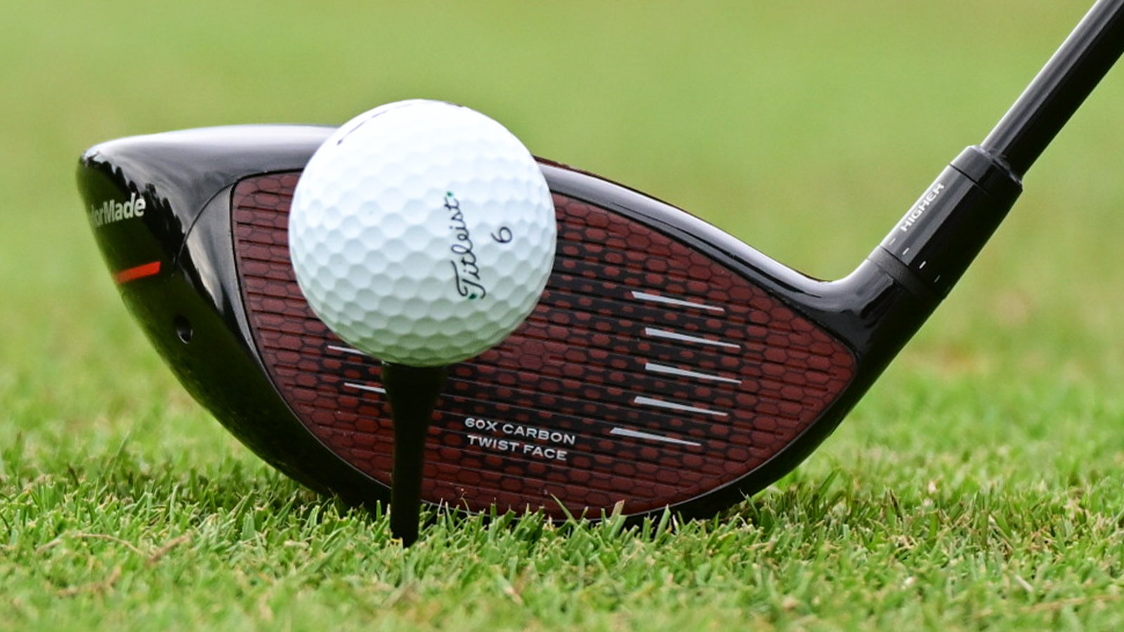 driver behind golf ball on tee