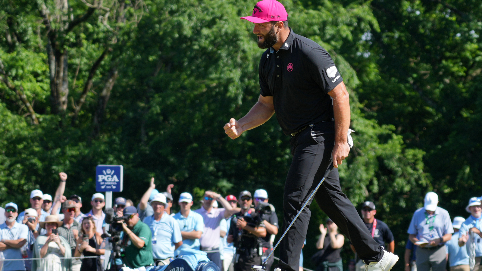 Jon Rahm fist pumps and celebrates a birdie at Quail Hollow during the PGA Championship