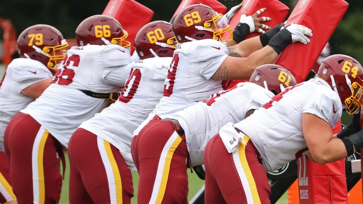 NFL linemen participate in sled drill
