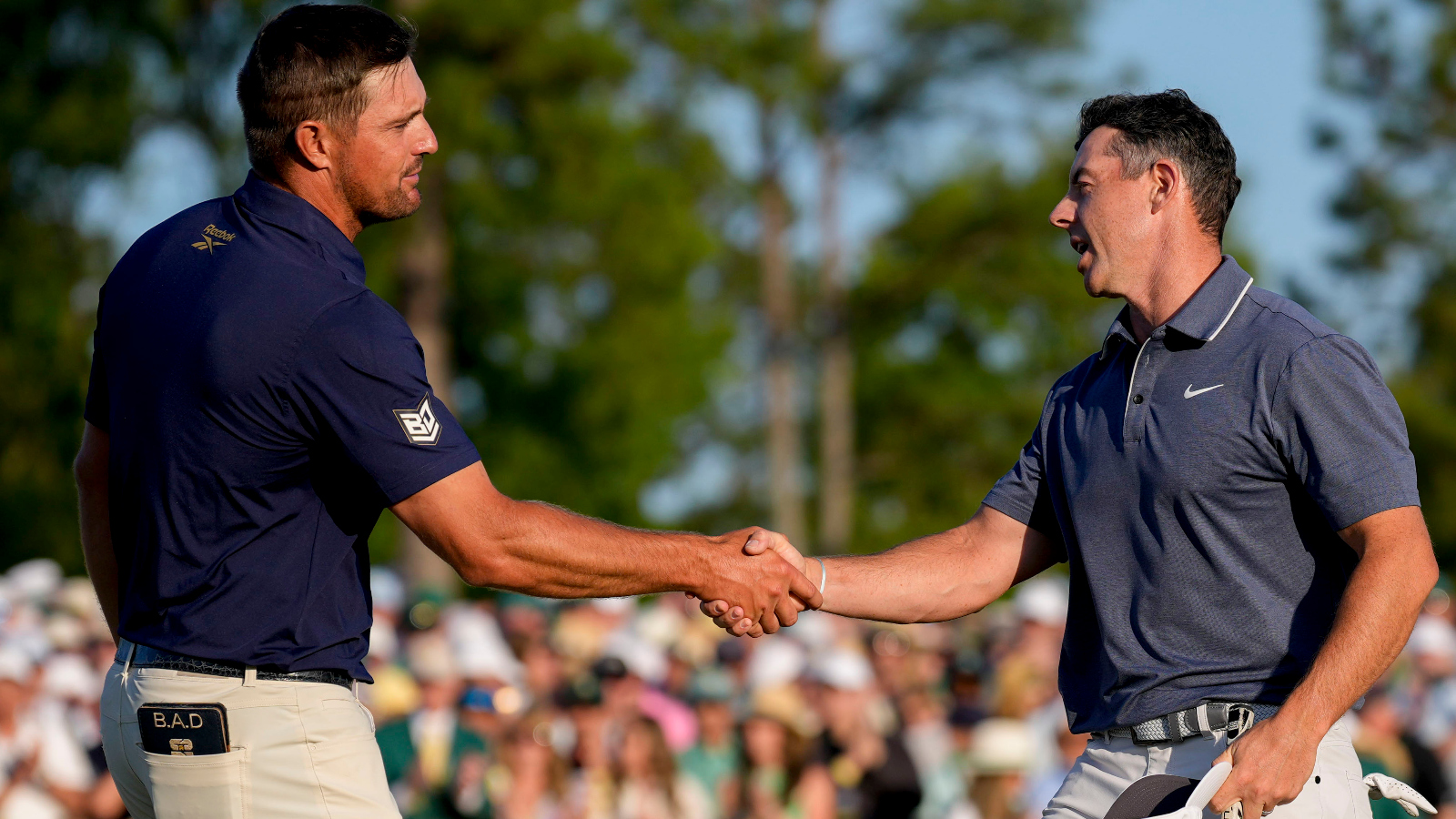Rory McIlroy shaking hands with Bryson DeChambeau