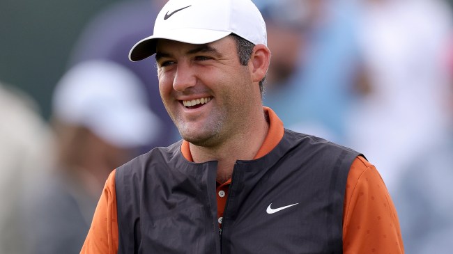 Scottie Scheffler wearing orange shirt during PGA Championship practice round