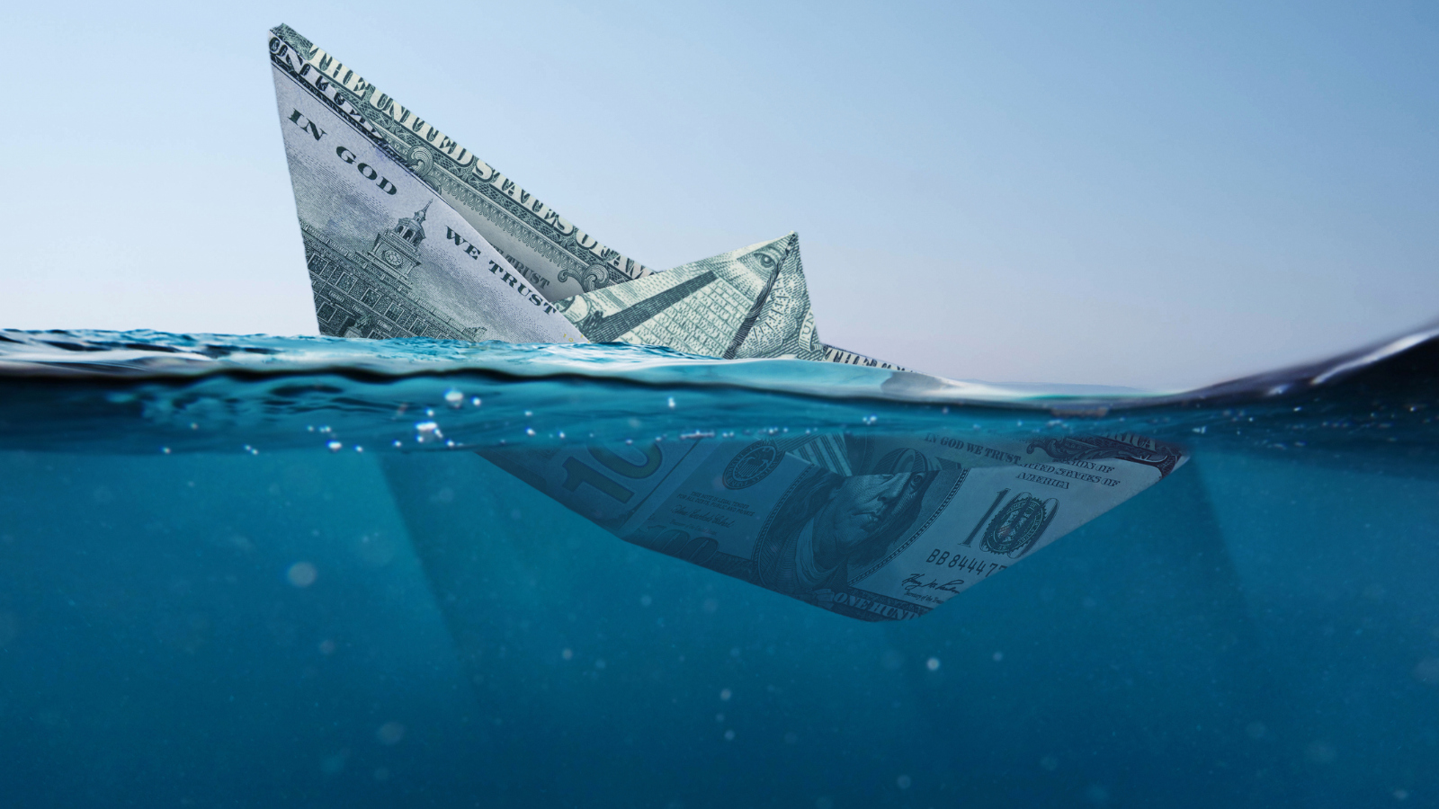 image of sinking money as a ship