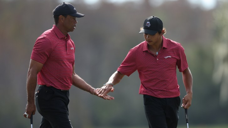 Tiger and Charlie Woods together on the golf course