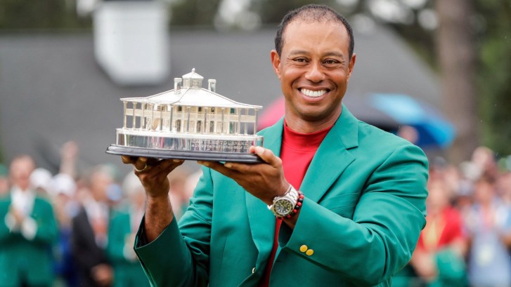 Tiger Woods holding the Masters trophy at Augusta National Golf Club