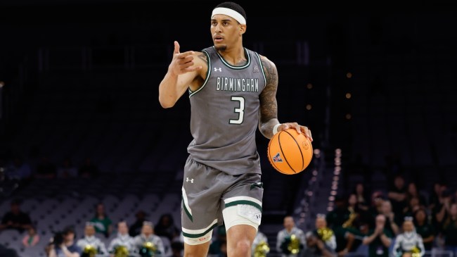 UAB basketball player Yaxel Lendeborg dribbles up the court.