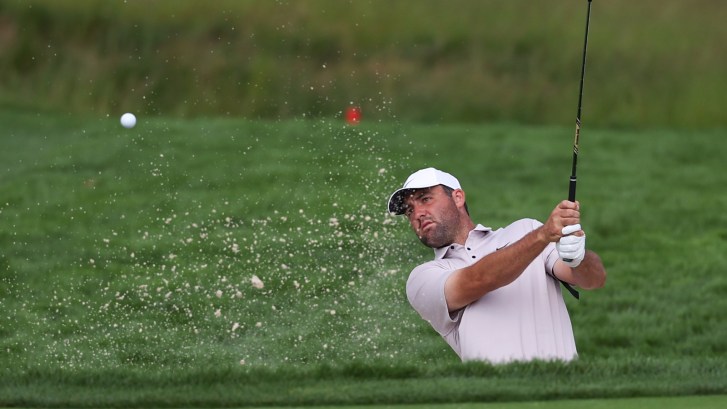 Scottie Scheffler plays from bunker on 2nd hole at Oakmont Country Club