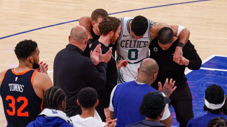 Boston Celtics star Jayson Tatum is helped off the court after tearing his achilles