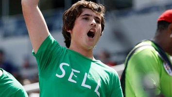 A’s Fan With ‘Sell’ Shirt Swarmed By Security Guards After Posting Up Behind Pregame Show Desk