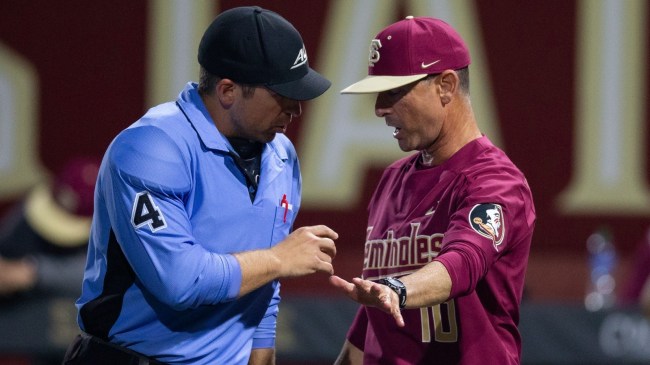 Florida State baseball coach Link Jarrett speaks to an umpire.