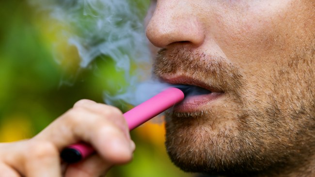 Man hitting disposable vape