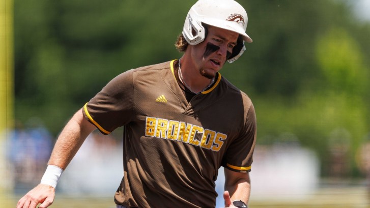 A Western Michigan baseball player scores a run