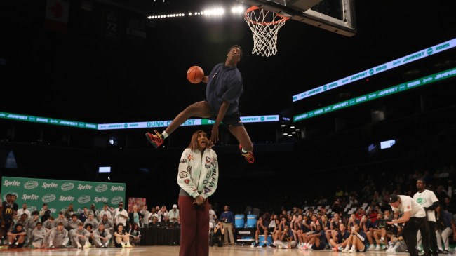 AJ Dybantsa dunks over Angel Reese at the McDonald's All-America Game