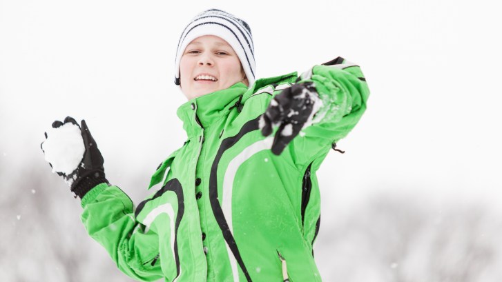 Kid throwing snowball