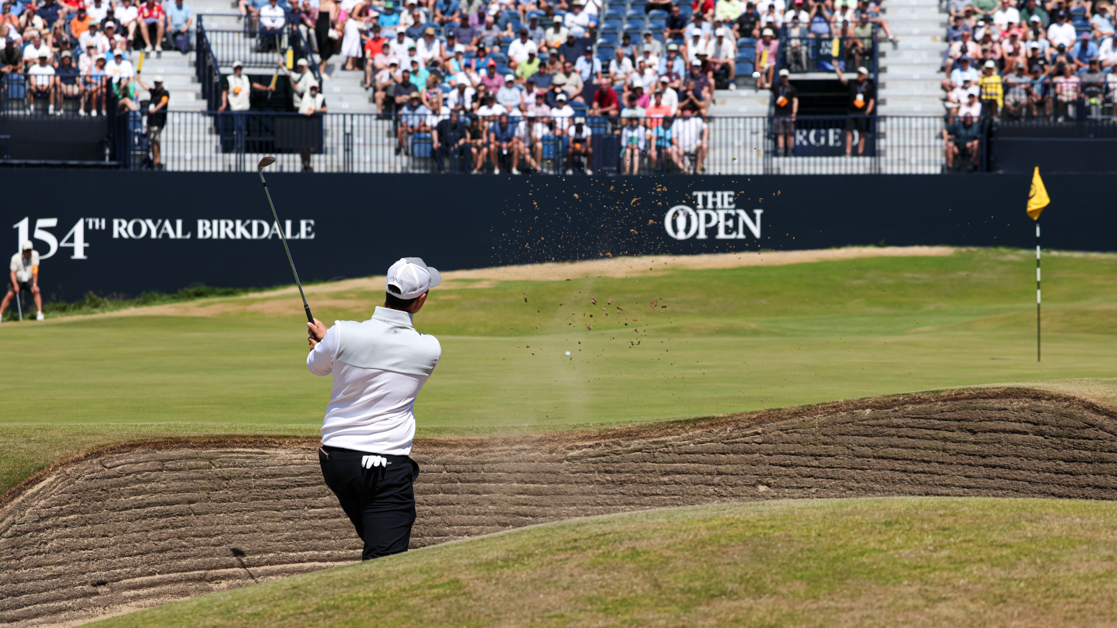 golfer hits sand shot during practice round of 154th Open Championship at Royal Birkdale in England