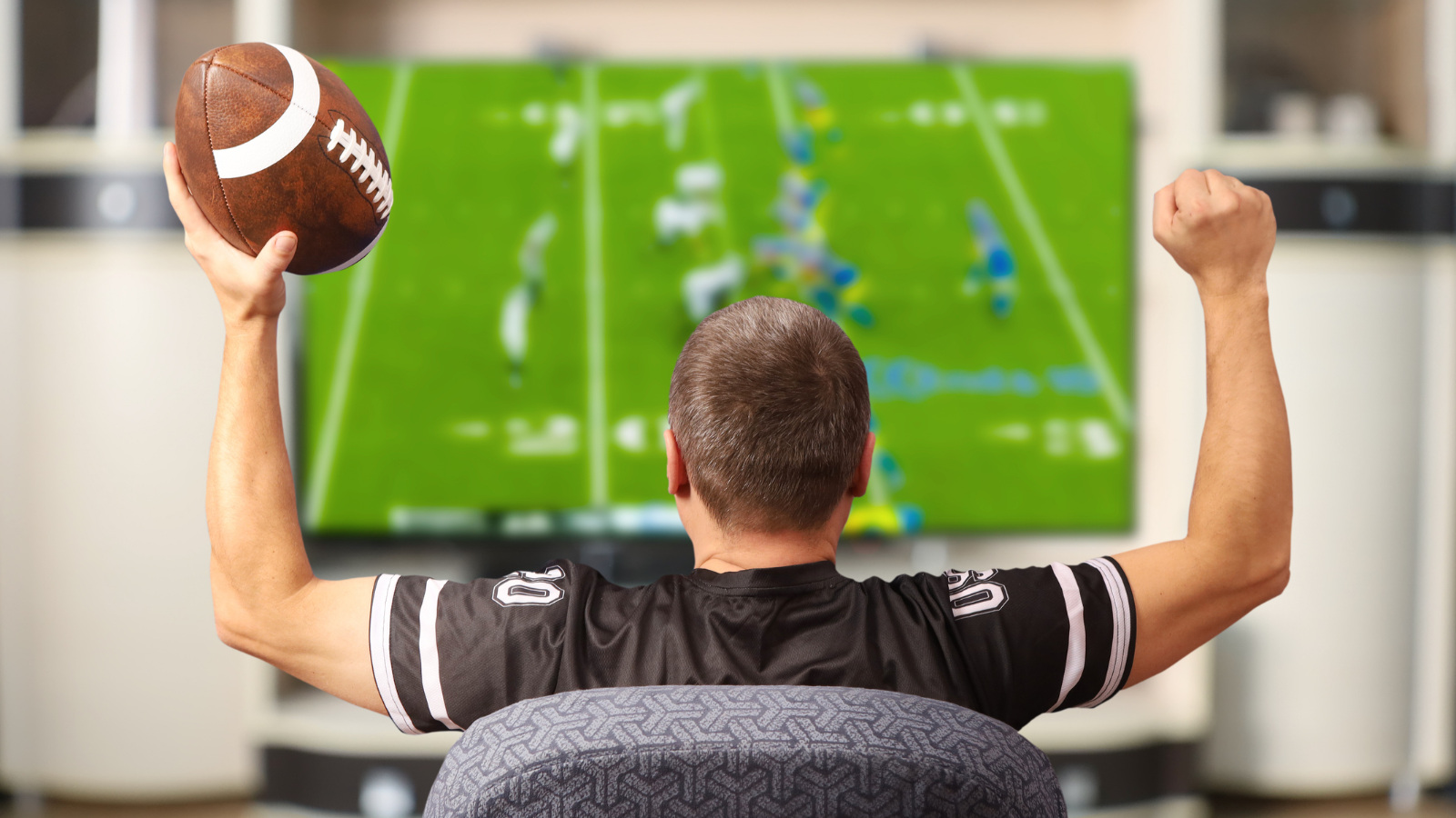 diehard fantasy football fan watching NFL game on Sunday