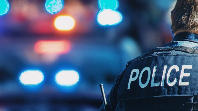 American-policeman-and-police-car