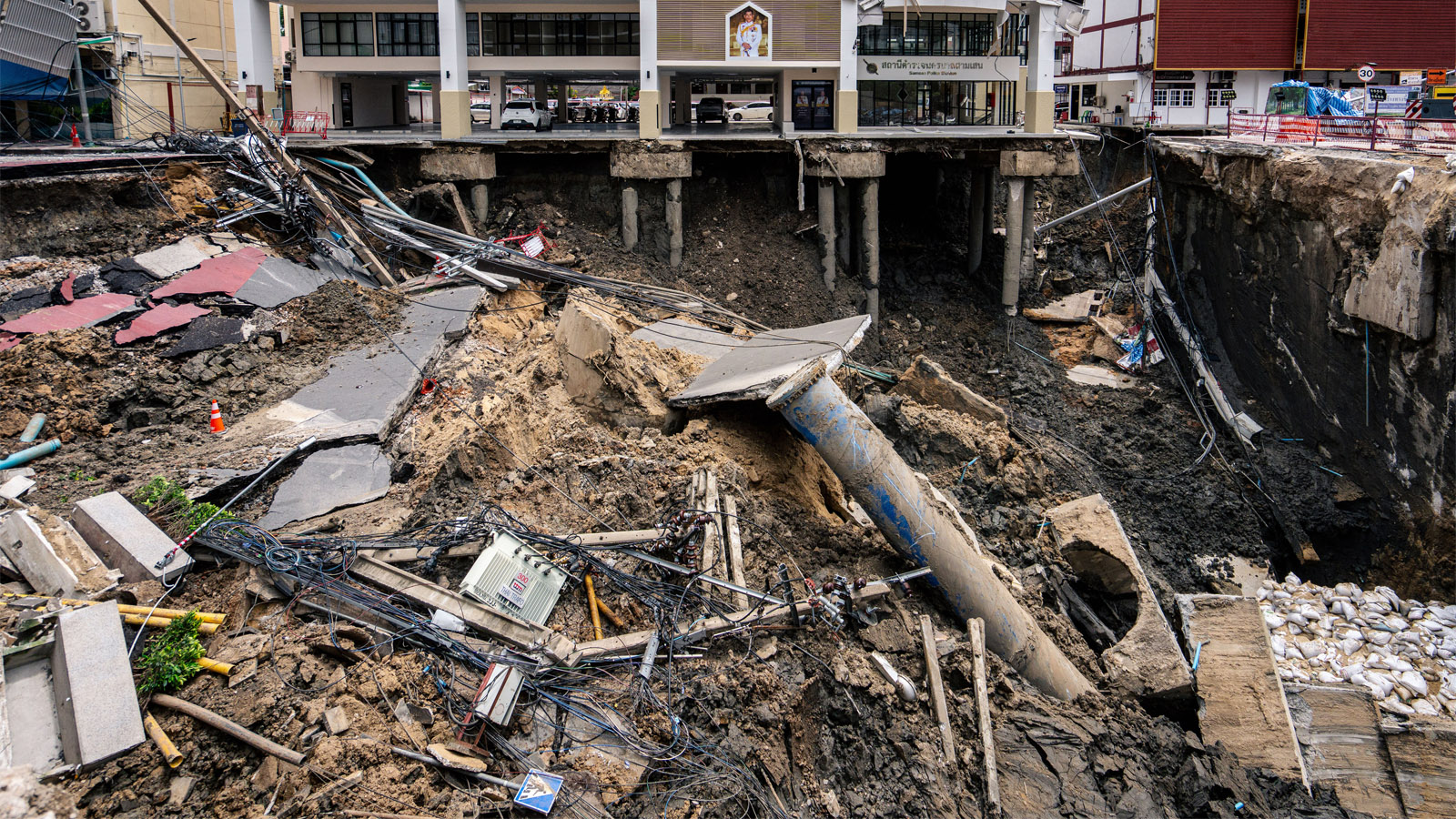 Giant Sinkhole In Thailand Swallows Entire Street In Seconds