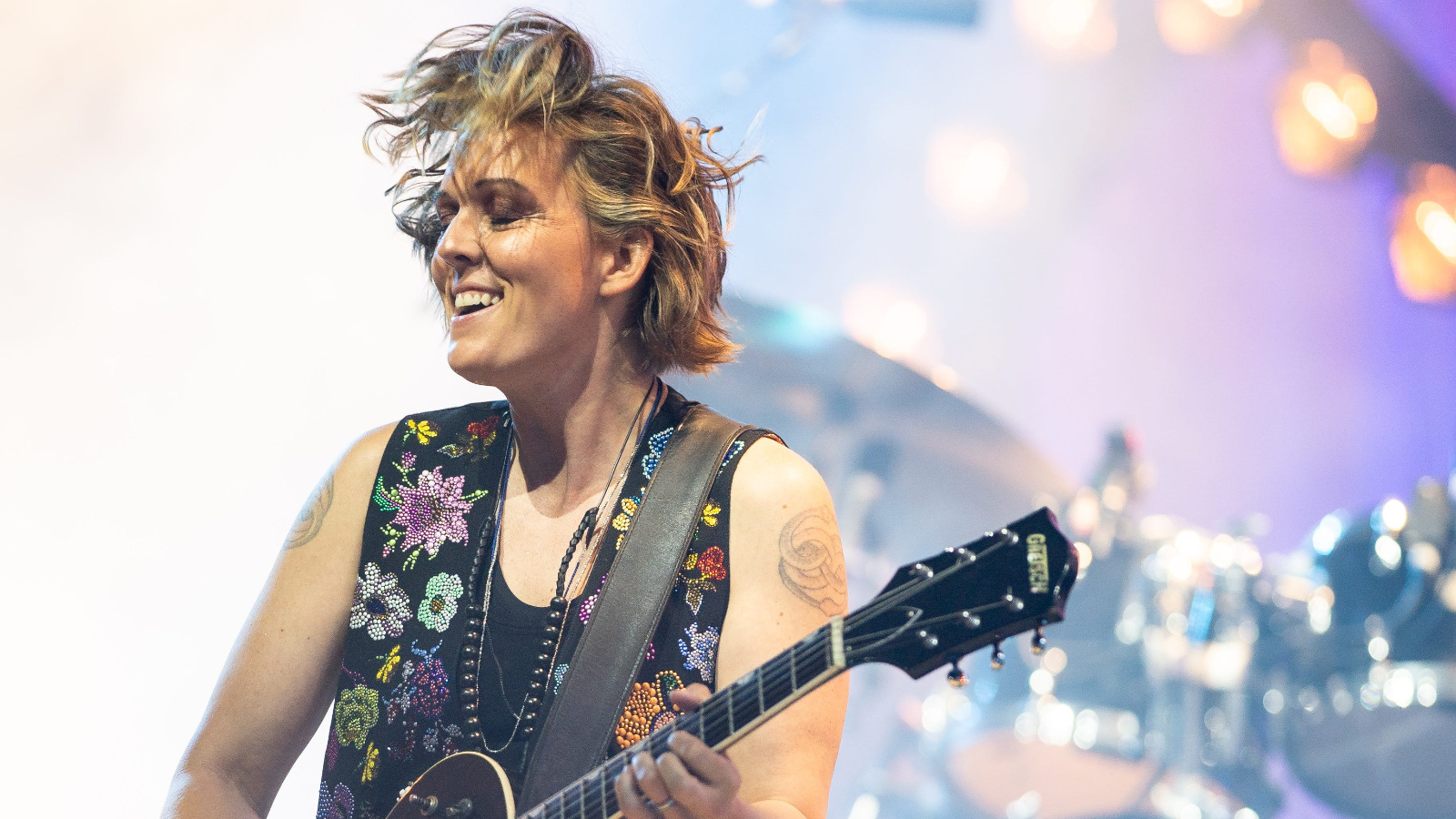 Brandi Carlile on stage with guitar