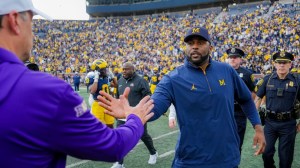 Sherrone Moore of Michigan and Jedd Fisch of Washington