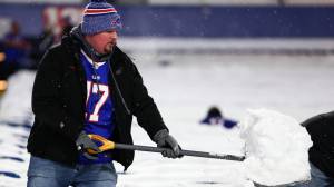 Buffalo Bills fan shoveling snow