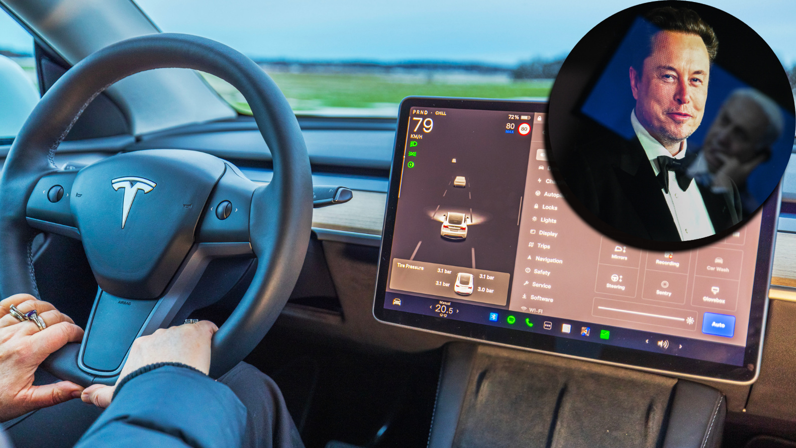 Elon Musk next to Tesla FSD driving system