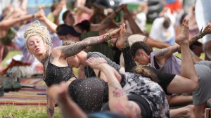 wook hippies doing yoga at a music festival