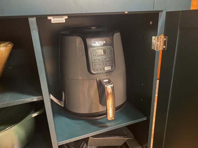 Ninja air fryer in cabinet