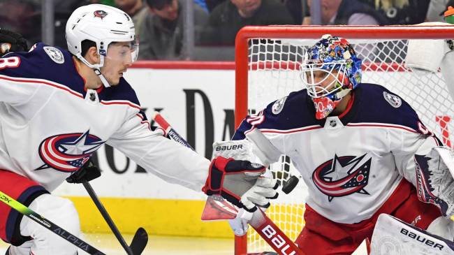 Zach Werenski and Elvis Merzlikin