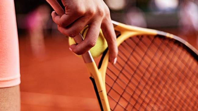 female tennis player holding racket