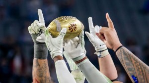 players holding up the Fiesta Bowl trophy
