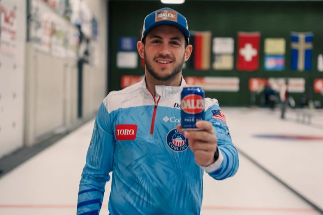 Korey Dropkin holding Dale's Pale Ale