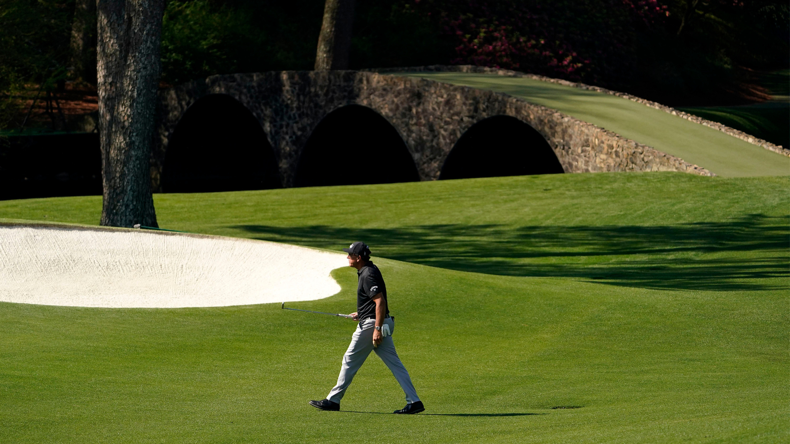 Phil Mickelson walking through Amen Corner at The Masters