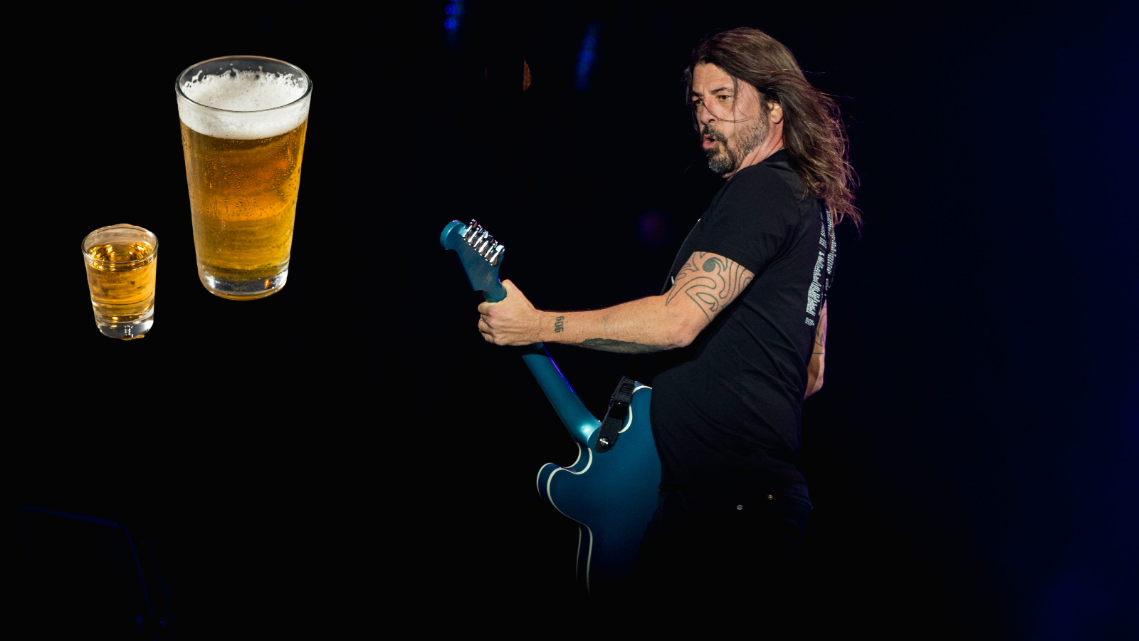Foo Fighters front man Dave Grohl staring at a beer