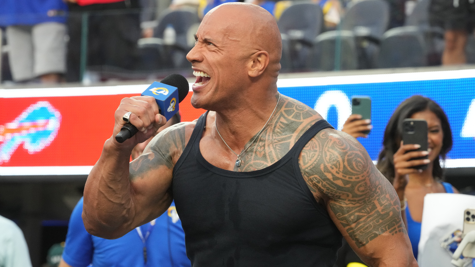 Dwayne 'The Rock' Johnson showing off muscles