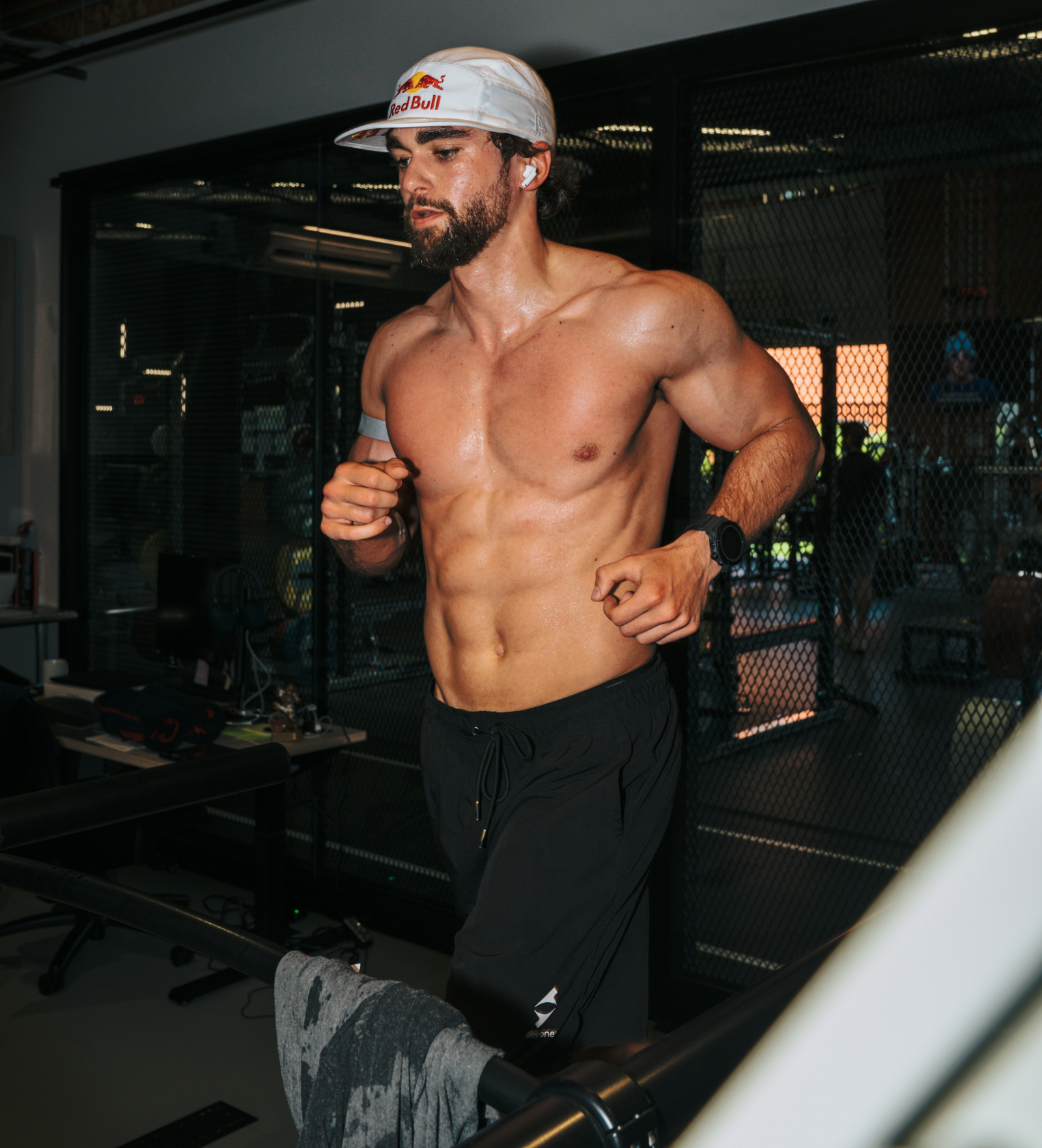 extreme endurance athlete Arda Saatci running shirtless on treadmill